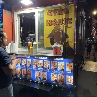 a man standing in front of a food truck