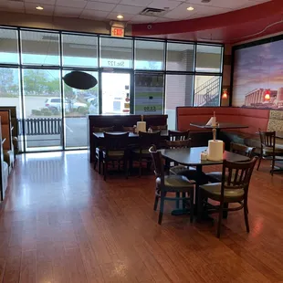 a dining area with tables and chairs