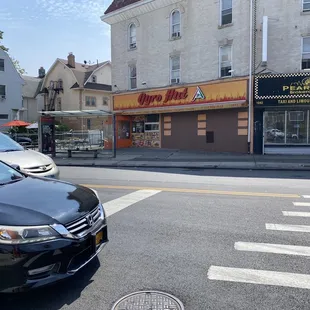 a black car parked on the side of the road