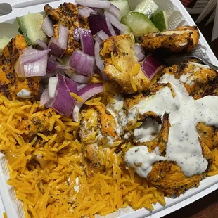 Chicken tikka over Rice. Half cooked
