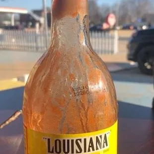 OMG what is that discolored blob growing in the neck of that bottle of hot sauce.