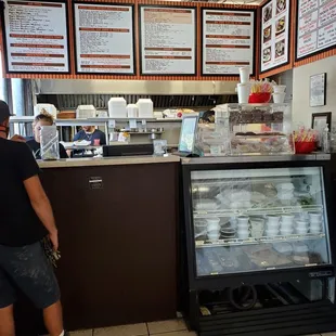 a man standing in front of a counter