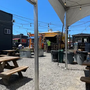 Yellow cart and covered seating.