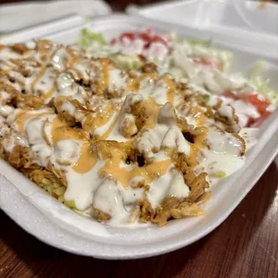a salad in a styrofoam container