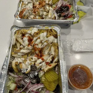 two trays of food on a table