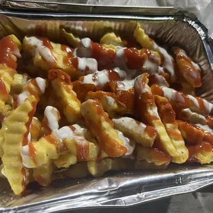 Topped with ketchup, spicy sauce, white sauce