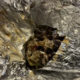 a piece of food wrapped in foil