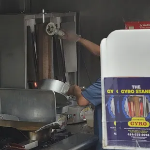 Shaving the gyro meat