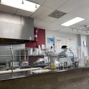 a kitchen with a counter and a counter top