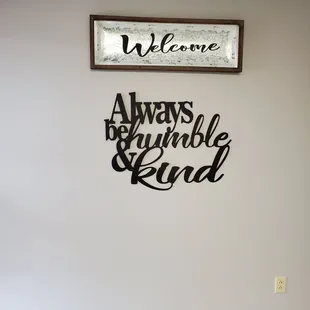 a welcome sign on a wall