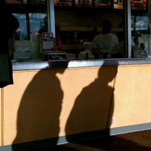 two people standing at a counter