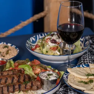 Kofte Kebab Plate (Ground Beef), Greek Salad, Babaganus, Red Wine