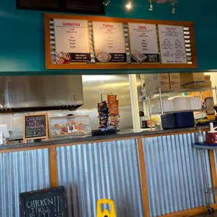 a restaurant counter with menus