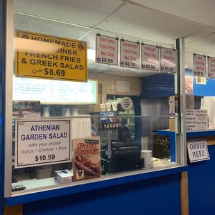 a man standing in front of a window