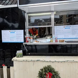 a food truck with a wreath on it