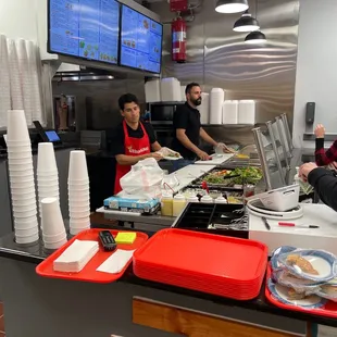 a group of people working in a restaurant