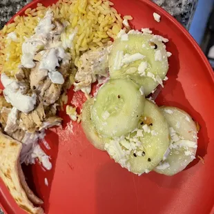 Plated at home chicken and salad cucumber