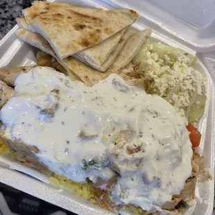 The chicken plate ! With rice and tzatziki sauce !! Cucumber salad !