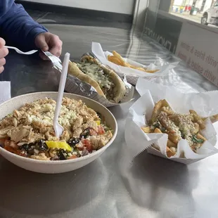 Grilled chicken salad, Greek Fries, Philly Cheesesteak and an order of fries.