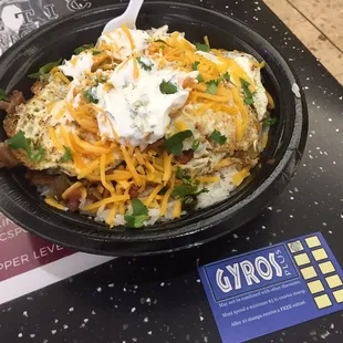 Moko Loco. Rice, tomatoes and onions, gyro meat (or chicken), topped with a fried egg, tzatziki sauce, cilantro and cheese!