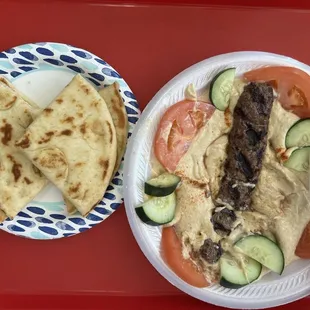 Hummus, kefta kabob, tomato, cucumber, and pita bread