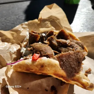 a piece of meat on a pita