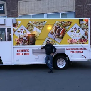 a man standing in front of a food truck