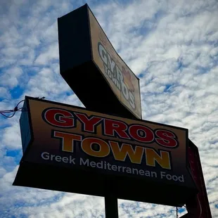 a sign for gyros town