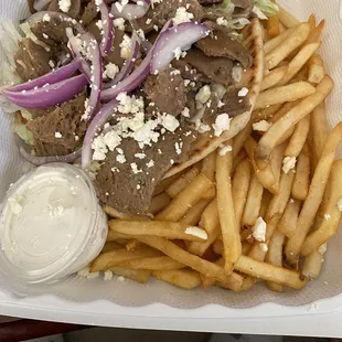 a tray of food with french fries