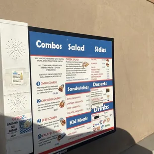 a menu on a sign in front of a building