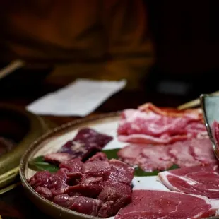 a plate of meat and vegetables