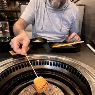 Tomas, from Slovakia, toasting a marshmallow for the first time!