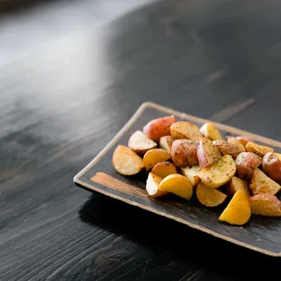 a plate of potatoes on a table