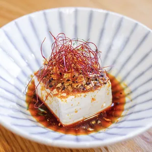 Hiyayakko is a perfect appetizer or side dish--Japanese chilled soft tofu with crunchy chili garlic sauce.