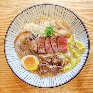 Gyukotsu Premium Ramen - homemade noodles, beef broth, domestic wagyu, beef tongue, truffle wagyu wontons, beef chashu,  menma, tamago.