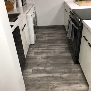 a kitchen with a washer and dryer