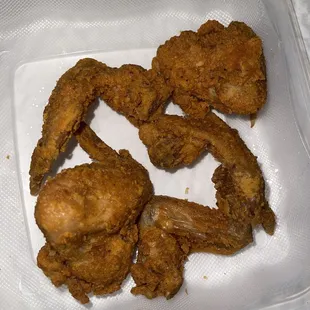 fried chicken in a plastic container