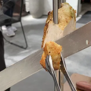 a piece of meat on a fork