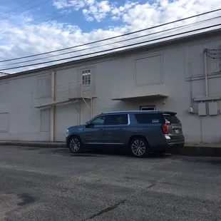 two cars parked in front of a building