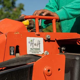 a man operating a lawn mower