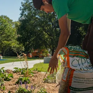 a woman tending to a garden