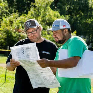 two men looking at a map