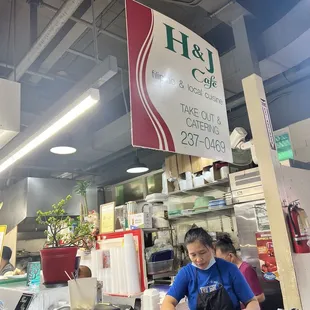 a woman working at a counter