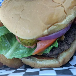 Double Meat Burger with added cheese, bacon and a side of onion rings.