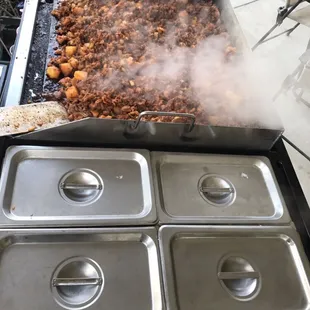 Cooking the pastor with pineapple