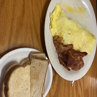 an omelet with bacon and toast