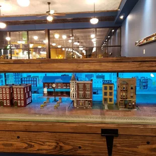 Train decor inside new location on square.