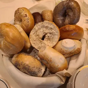 a bowl of bagels on a table