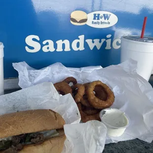 Philly cheesesteak, onion rings and shake.