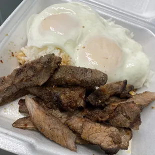 a plate of meat and eggs